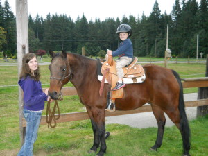 My daughter Haley and our old gelding Imperial Outlaw (AKA: “Cowboy”)